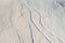 Snowy abstract off-piste skiing backround with ski and snowboard trails and tracks on new virgin powder snow. morning