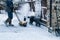 Snowy Backyard Patio.Winter  Landscape  with barbeque area, snowbanks of white snow, pine trees in country garden.