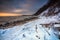 Snowy beach in Gdynia Orlowo at sunrise, Baltic Sea. Poland