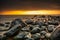 Snowy beach in Gdynia Orlowo at sunrise, Baltic Sea. Poland