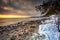 Snowy beach in Gdynia Orlowo at sunrise, Baltic Sea. Poland