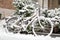 Snowy bike. Snowdrifts and snowfall. Vehicle and urban mobility