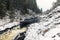 Snowy cascade waterfall. Landscape photo of Kivach Falls on a cold cloudy winter day