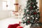 Snowy Christmas tree with red oval shape toys room decoration