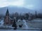 Snowy church and in the background the mountains of the High Tatras in Slovakia