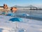 A Snowy Clock Tower Beach in Montreal with the Molson Brewery in