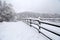 Snowy corral fence wintertime as a background panoramic photo