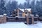 Snowy cottage in forest. Winter landscape with yellow wooden luxury house.