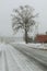 Snowy country lane on an overcast winter day