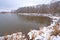 Snowy Cove on A Forested Lake