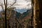 Snowy dramatic Tatry Mountains through the forest in Pieniny Mountains in spring, Malopolska, Poland