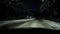 Snowy drive at night