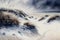 Snowy dunes by the sea, snow-covered plants, dramatic sky, sand dunes, painted in watercolor