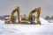 Snowy excavators during winter in Daybreak Utah