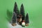 Snowy forest firs gnome and reindeer green