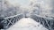 A snowy, frosty winter walking bridge