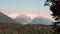 Snowy and green mountains in sunlight of Argentina.