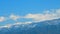 Snowy Hill With Moving Clouds Blown By The Wind. Beautiful Mountain Landscape In Winter. Timelapse.