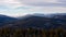 Snowy hilly landscape view from above with clouds rolling over the ridge, Jeseniky