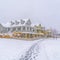 Snowy homes and footprints on snow in Daybreak