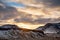 Snowy Icelandic mountains with dramatic cloudy sky