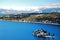 A snowy island stands in the middle of a Lake