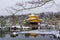 Snowy Kinkaku-ji Temple in winter. Famous tourist attraction in Kyoto, Japan. The Golden Pavilion Snow landscape.