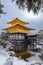 Snowy Kinkaku-ji Temple in winter. Famous tourist attraction in Kyoto, Japan. The Golden Pavilion Snow landscape.