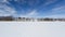 Snowy lake ice feather clouds in winter