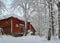 Snowy landscape with historic horse stable in winter