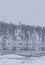 A snowy landscape with an old copper mine in central Norway. Cristianus Sextus mine area in first snow.