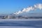 Snowy landscape with steaming coal power plant