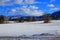 Snowy meadow and cloudy sky in Pyrenees