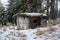 A snowy military concrete bunker in a forest. Orlicke hory, Czech republic