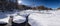 Snowy mountain in the French Alps. blue sky with sun. Snowfall in autumn with arron trees