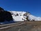 snowy mountain hill next to a barren road in Finnmark