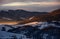 Snowy mountain hills at sunrise