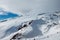 Snowy mountain landscape on the blue sky background