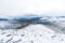 Snowy mountain peaks in Rondane national park in Norway. Snowy, foggy and frozen landscape during winter.