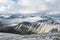 Snowy mountain peaks in Rondane national park in Norway. Snowy, foggy and frozen landscape during winter.