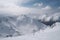 snowy mountain range, with skiers and snowboarders enjoying the winter weather