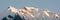 Snowy mountain ridge in the Alps at first light