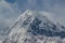 Snowy mountain`s peak surrounded by clouds at Mardi Himal trek