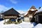 Snowy mountain village with ancient palloza houses made with stone and straw and galician granary horreo. Piornedo, Lugo, Spain.