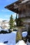 Snowy mountain village with galician granary horreo and fir tree. Piornedo, Lugo, Spain.