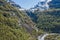 Snowy mountain and zigzag road.