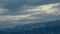 Snowy Mountains Near Kobuleti, Adjara, Georgia. Snowcapped Mountain Peaks Under Clouded Sky. Timelapse.