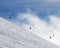 Snowy off-piste ski slope and chair-lift in fog