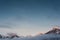 Snowy orange peaks of mountain chain in winter