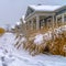 Snowy path with footprints along homes in Daybreak